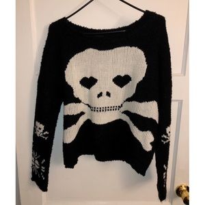 Black knit sweater with white skull and crossbones